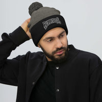 Black pom-pom beanie with Billiards Pool Hall embroidered artwork, front view