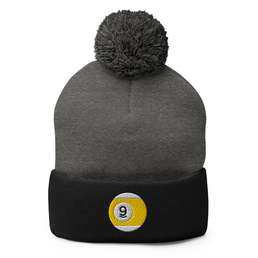 Black pom-pom beanie with Nine Ball Line Billiards embroidered artwork, front view