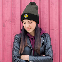 Black pom-pom beanie with Nine Ball Line Billiards embroidered artwork, front view