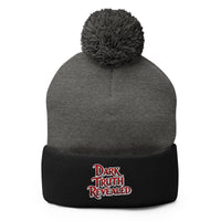 Black pom-pom beanie with Dark Truth Revealed embroidered artwork, front view