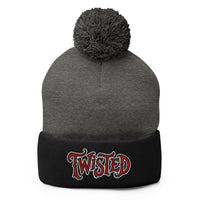 Black pom-pom beanie with Twisted Horror Carnival embroidered artwork, front view