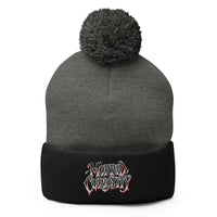Black pom-pom beanie with Morbid Curiosity embroidered artwork, front view