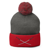 Red pom-pom beanie with Dual Samurai Swords Anime Warrior embroidered artwork, front view