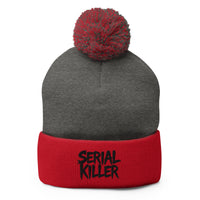 Red pom-pom beanie with Serial Killer True Crime embroidered artwork, front view