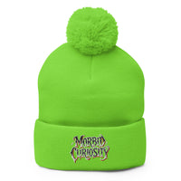Green pom-pom beanie with Morbid Curiosity embroidered artwork, front view