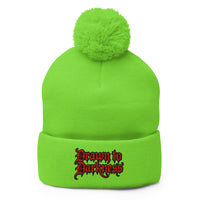 Green pom-pom beanie with Drawn to Darkness embroidered artwork, front view