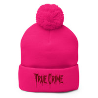 pom-pom beanie with Blood Drip True Crime embroidered artwork, front view