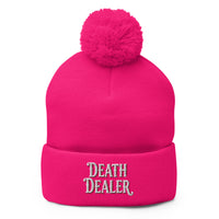 pom-pom beanie with Death Dealer True Crime embroidered artwork, front view
