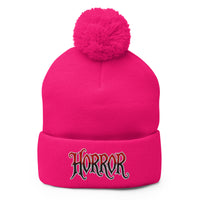 pom-pom beanie with House of Horrors embroidered artwork, front view