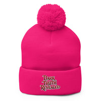 pom-pom beanie with Dark Truth Revealed embroidered artwork, front view