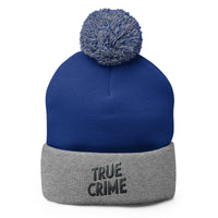 Gray pom-pom beanie with Detective Style True Crime embroidered artwork, front view