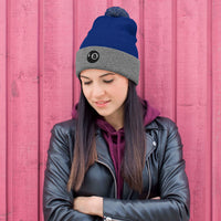 Gray pom-pom beanie with Black 8 Ball Billiards embroidered artwork, front view