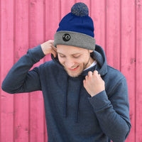 Gray pom-pom beanie with Black 8 Ball Billiards embroidered artwork, front view