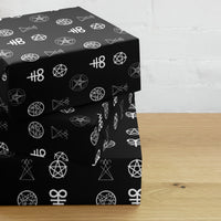 Demonology Occult Symbols pattern on wrapping paper sheets, front product mockup