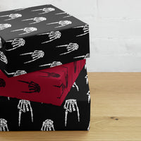 Devil Horns Bone Hand pattern on wrapping paper sheets, front product mockup