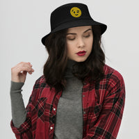 Black bucket hat with Winking Face Emoji embroidered artwork, front view