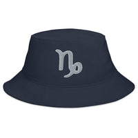 Navy bucket hat with Zodiac Sign Capricorn embroidered artwork, front view