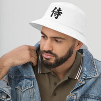 White bucket hat with Black Samurai The Japanese Kanji Symbol embroidered artwork, left-front view