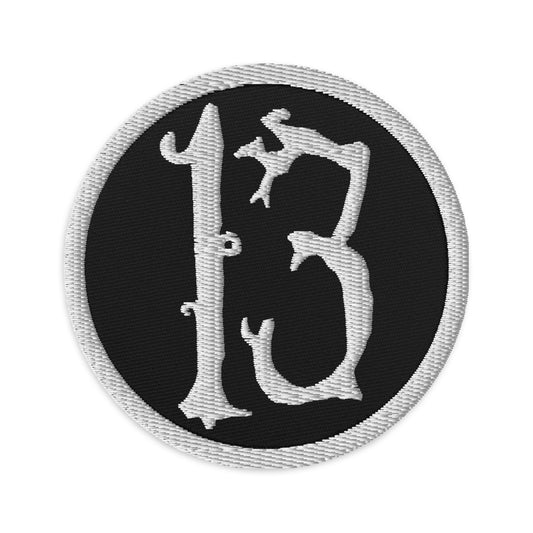 Circular embroidered patch featuring White Lucky Number 13 Goth Halloween #, front view