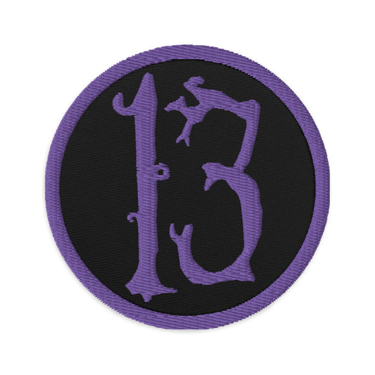 Circular embroidered patch featuring Purple Lucky Number 13 Goth Halloween #, front view