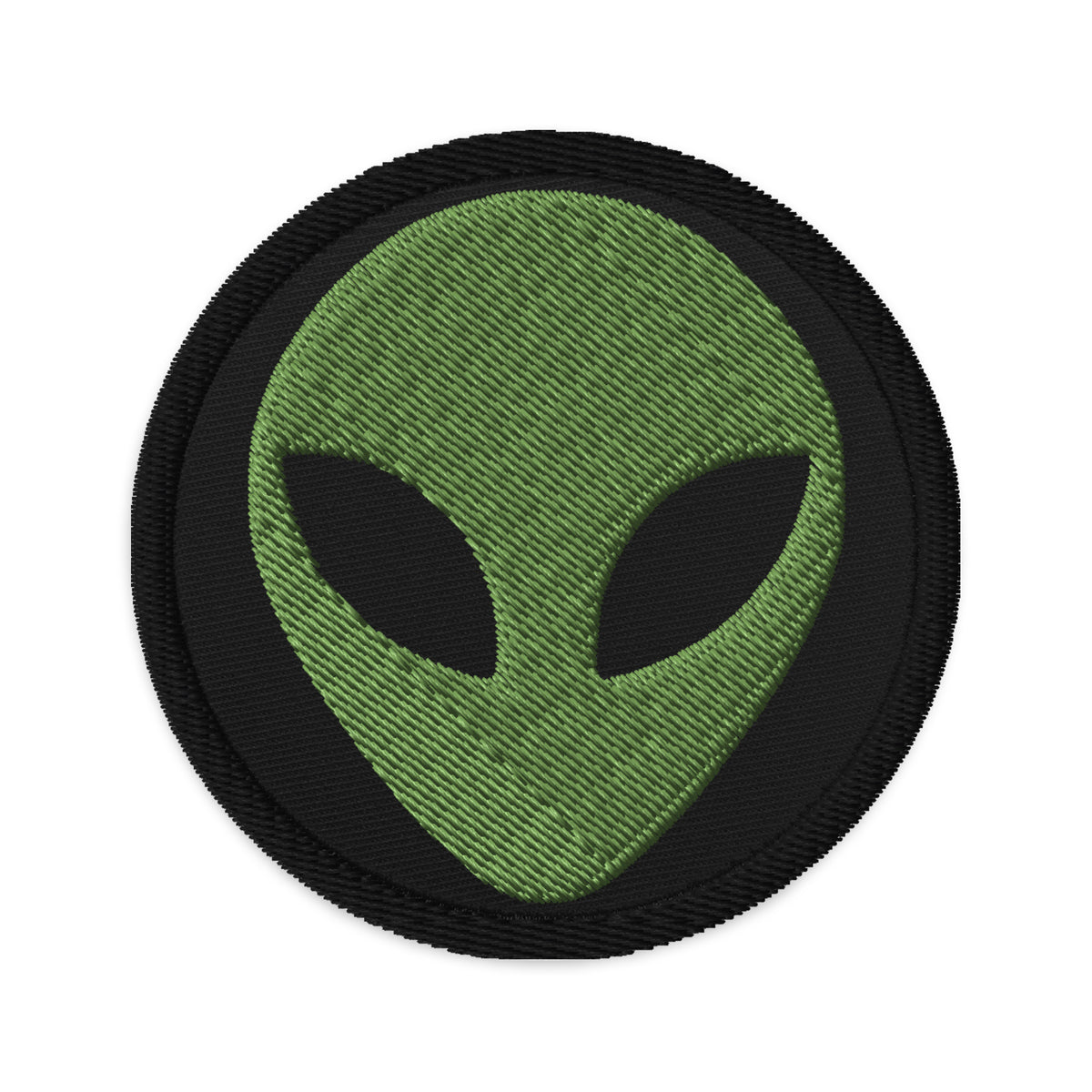 Circular embroidered patch featuring Alien Face Little Green Men, front view