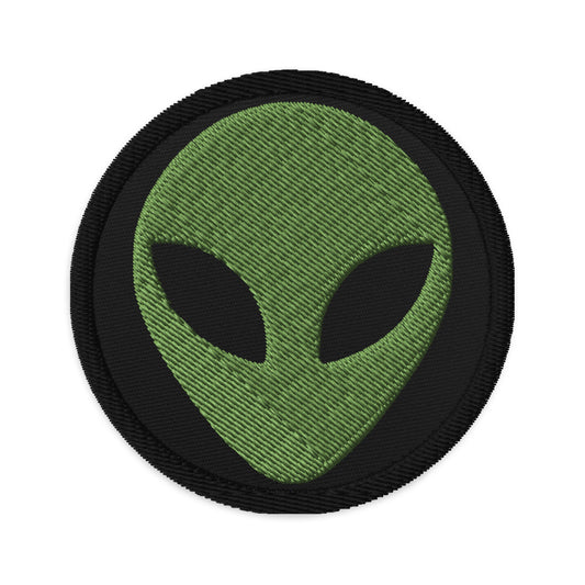 Circular embroidered patch featuring Alien Face Little Green Men, front view