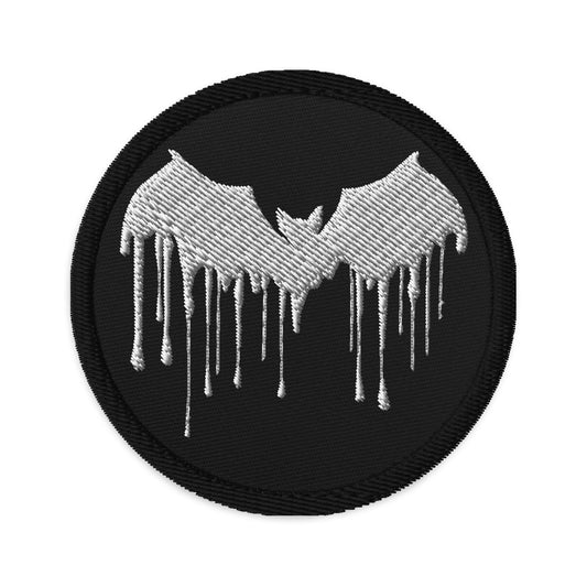 Circular embroidered patch featuring White Vampire Bat Blood Drip, front view