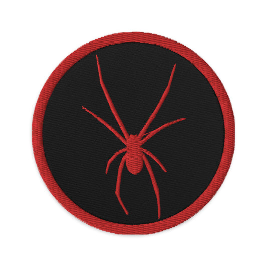 Circular embroidered patch featuring Red Arachnid Creepy Black Widow Spider, front view