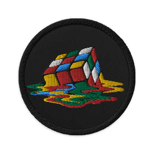 Circular embroidered patch featuring Melting Speed Cube Gaming Puzzle Box, front view