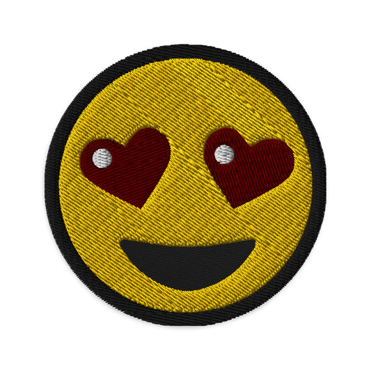 Circular embroidered patch featuring Heart-Eyes Emoji, front view