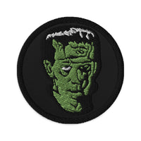 Circular embroidered patch featuring The Modern Prometheus Dr. Frankenstein's Monster, front view