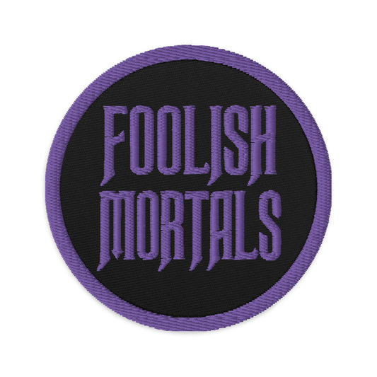 Circular embroidered patch featuring Purple Foolish Mortals Haunted Mansion, front view
