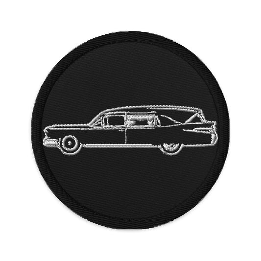 Circular embroidered patch featuring Hearse Funeral Car, front view