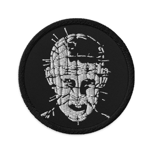 Circular embroidered patch featuring The Hell Priest Pinhead Cenobite Demon, front view