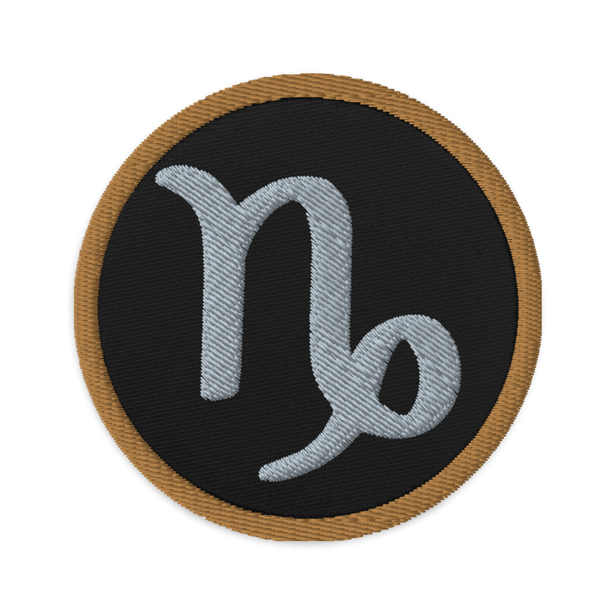 Circular embroidered patch featuring Brown Zodiac Sign Capricorn, front view