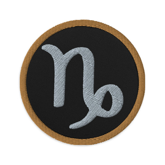 Circular embroidered patch featuring Brown Zodiac Sign Capricorn, front view