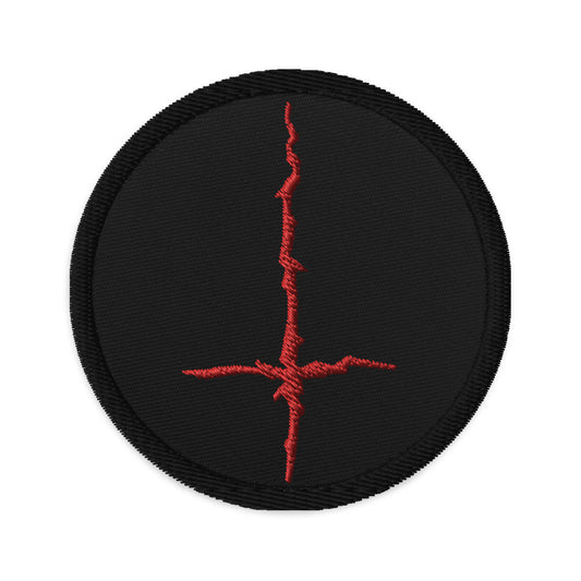 Circular embroidered patch featuring Red Black Metal Style Inverted Cross, front view
