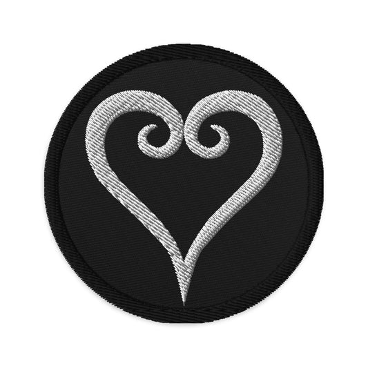 Circular embroidered patch featuring Kingdome Hearts, front view