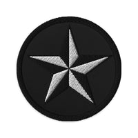 Circular embroidered patch featuring Black Nautical Star North Star, front view