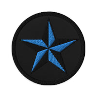 Circular embroidered patch featuring Black Nautical Star North Star, front view