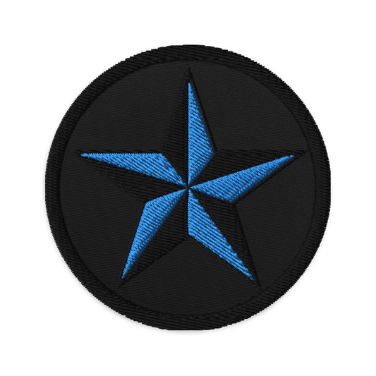 Circular embroidered patch featuring Black Nautical Star North Star, front view