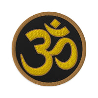 Circular embroidered patch featuring OM Sacred Spiritual Symbol, front view