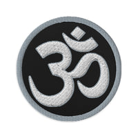 Circular embroidered patch featuring OM Sacred Spiritual Symbol, front view