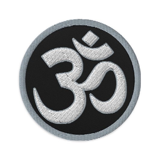 Circular embroidered patch featuring OM Sacred Spiritual Symbol, front view