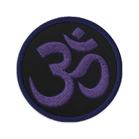Circular embroidered patch featuring OM Sacred Spiritual Symbol, front view