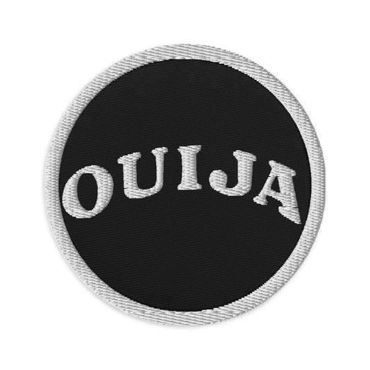 Circular embroidered patch featuring Ouija Spirit Board Words, front view