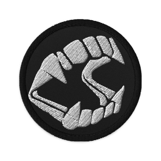 Circular embroidered patch featuring Vampire Fangs Novelty Halloween Toy Trick or Treat, front view