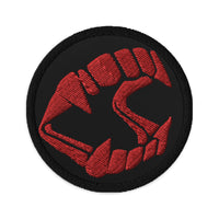 Circular embroidered patch featuring Vampire Fangs Novelty Halloween Toy Trick or Treat, front view