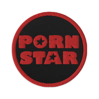 Circular embroidered patch featuring Porn Star Logo, front view