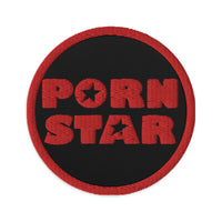 Circular embroidered patch featuring Porn Star Logo, front view
